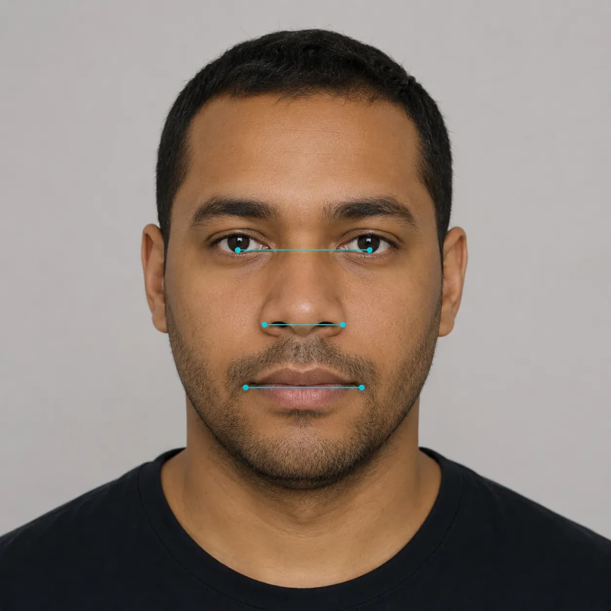 Facial proportion measurement lines showing eye spacing, mouth width, and nose breadth on a man's face